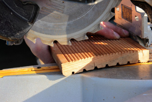 Mitre saw cutting decking timber